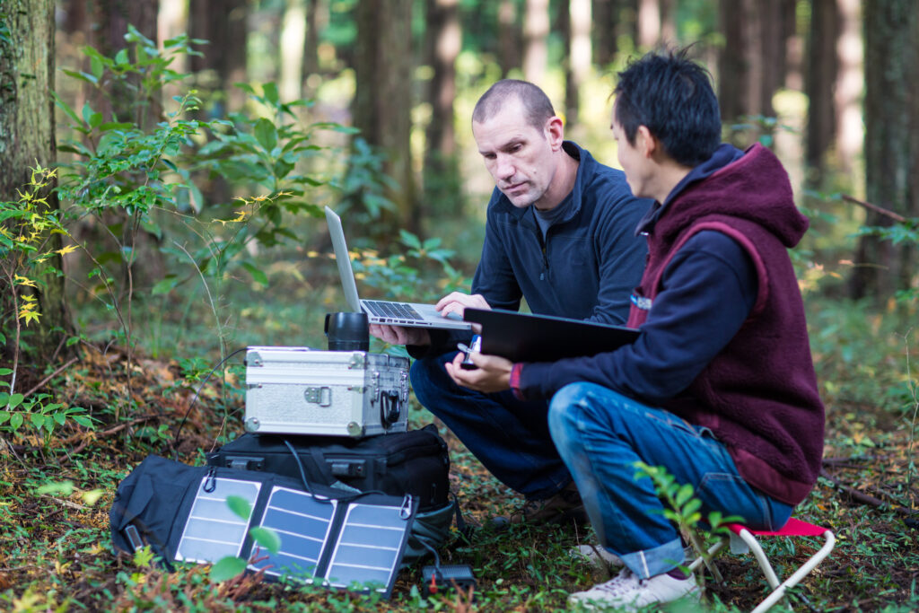 Environmentalists monitor the forest with a solar powered field laboratory
