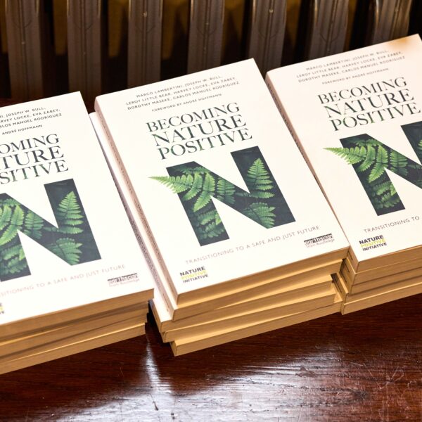 Becoming Nature Positive - stacks of books c. Harvey Williams-Fairley